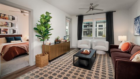 A living room with a brown carpet and a brown floor.