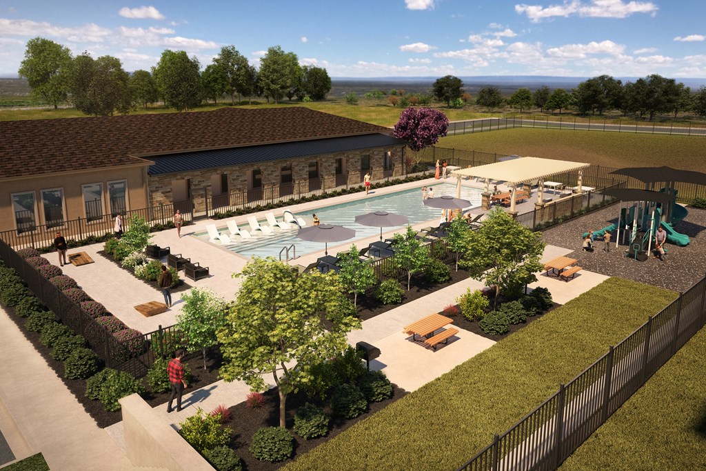 an aerial view of the pool and patio area of a resort
