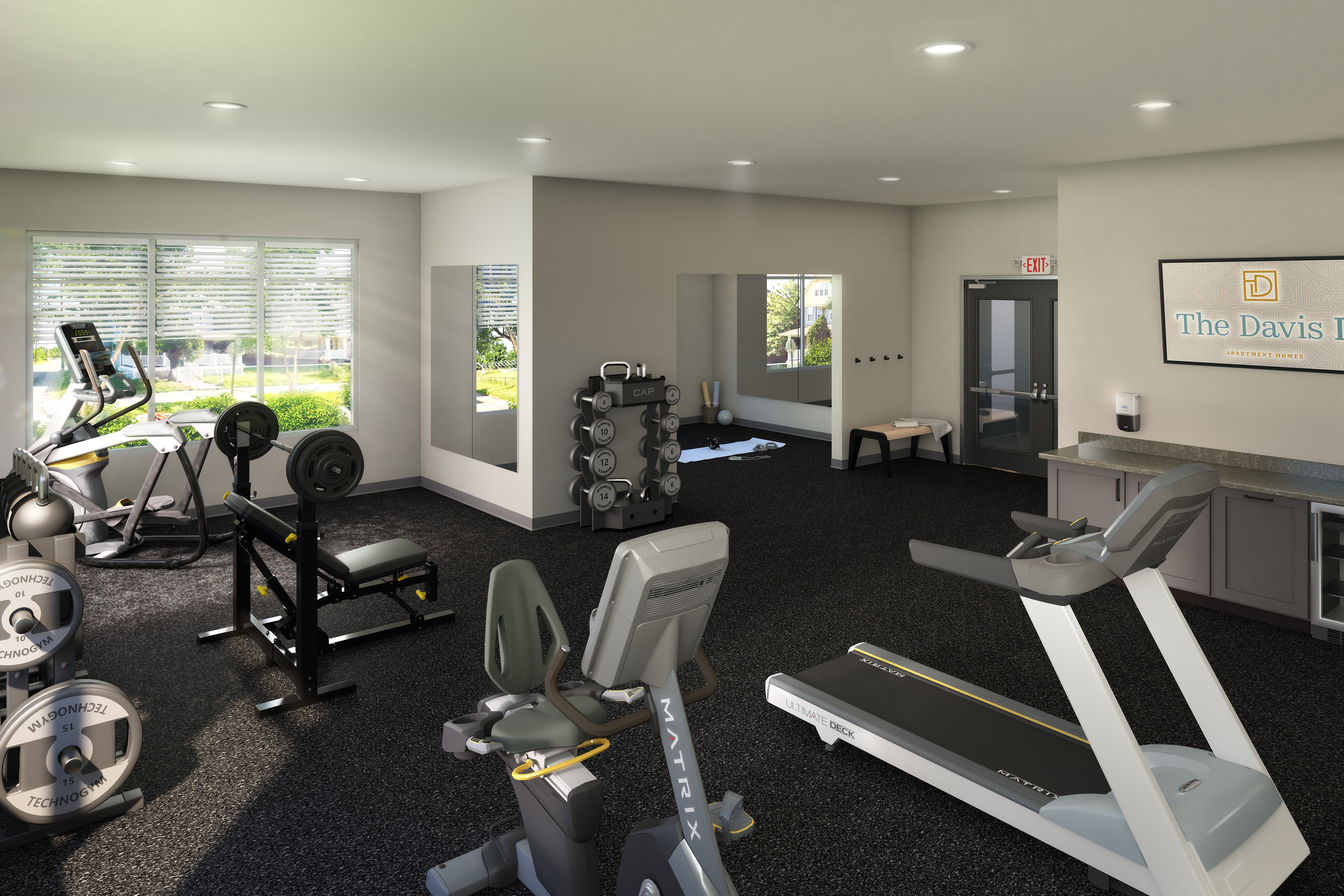 A gym with a treadmill, weights and exercise equipment.