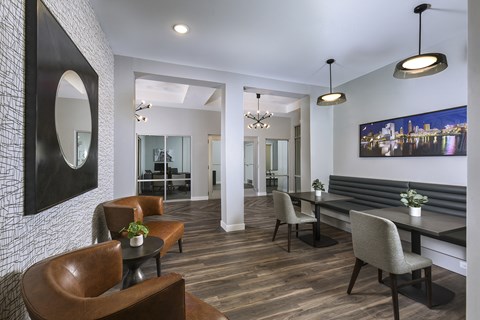 Modern resident lounge featuring private booth seating, contemporary lighting, and inviting spaces for work, study, or socializing.