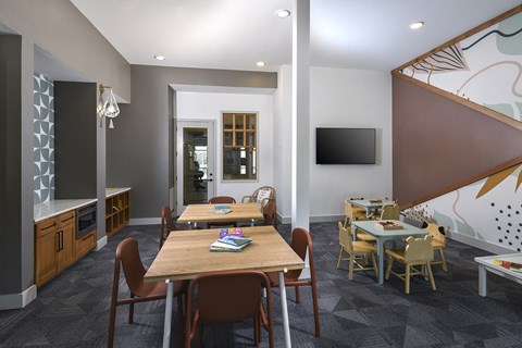 Modern business center featuring computer workstations, comfortable seating, and a productive workspace for remote work or study.