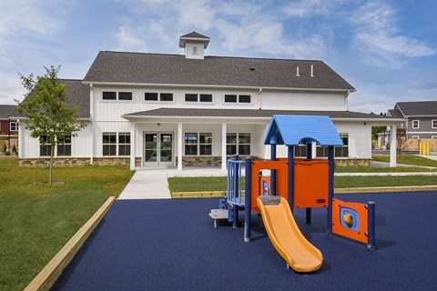 Community playground featuring modern play equipment, slides, and a welcoming outdoor space for recreation and exploration.