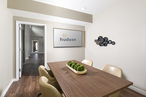 Modern business center featuring computer workstations, comfortable seating, and a productive workspace for remote work or study.