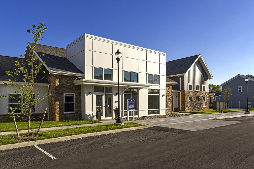 a modern building with a street lamp in front of it