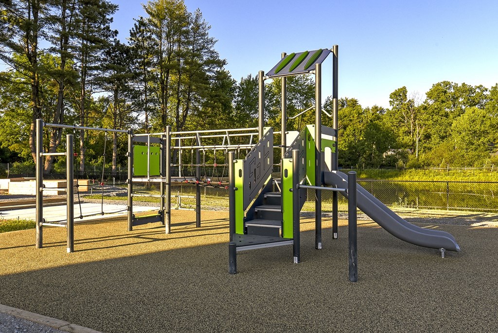 a playground with a slide and climbing equipment