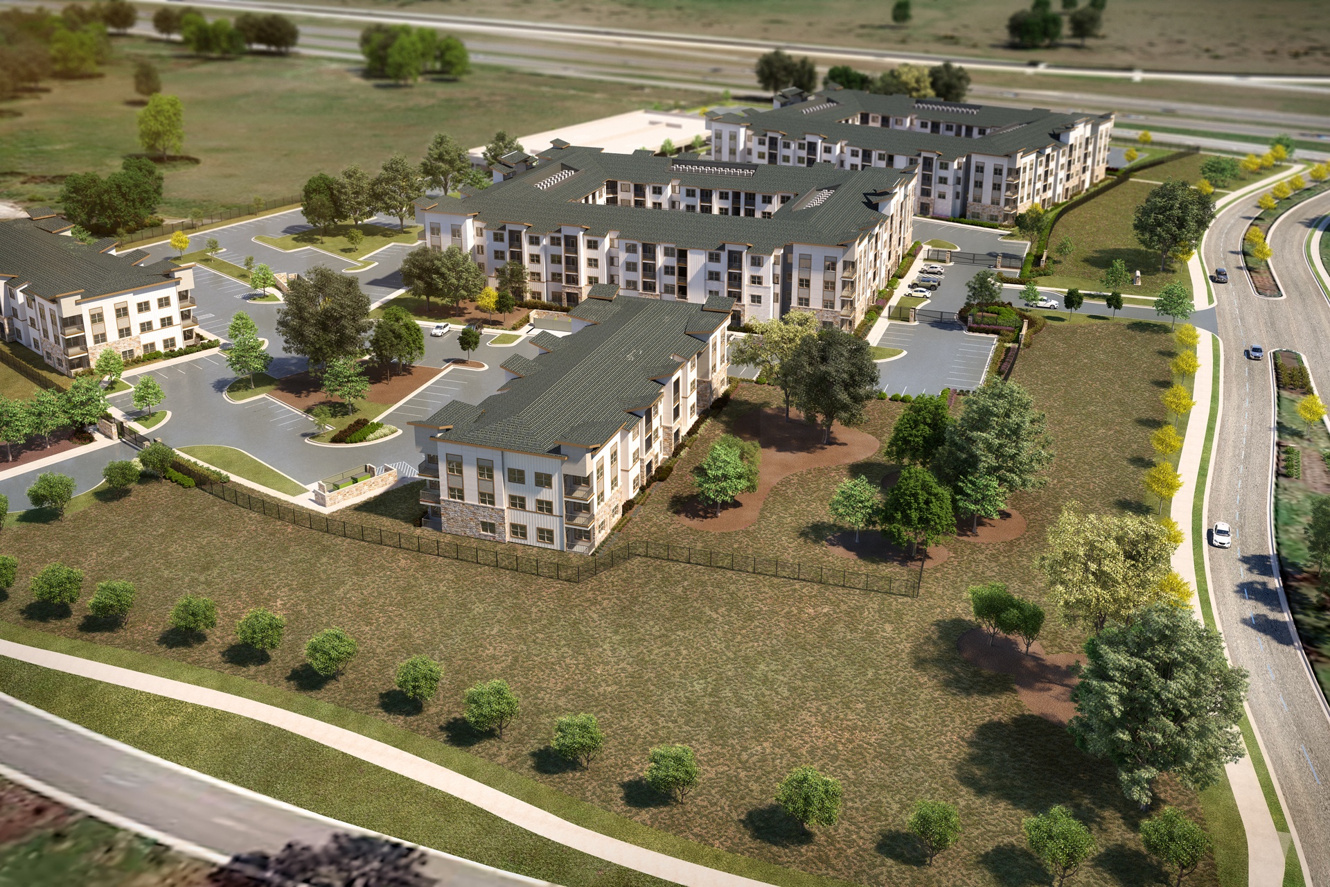 an aerial view of a building complex with roads and trees