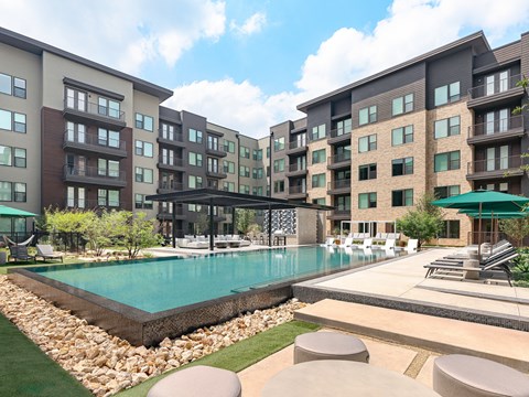 a swimming pool in the middle of an apartment building