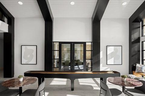 Inviting resident lounge featuring comfortable seating, contemporary décor, and a welcoming space for relaxation and connection.