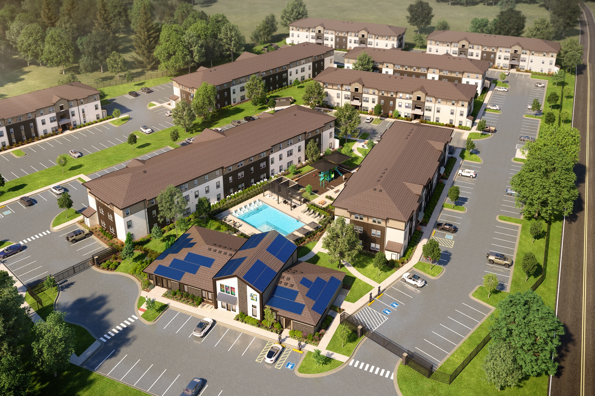 A large building complex with a pool and parking lot.
