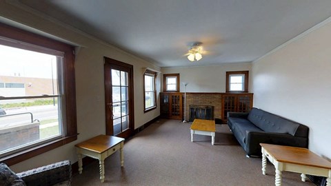 A living room with a fireplace and a couch.