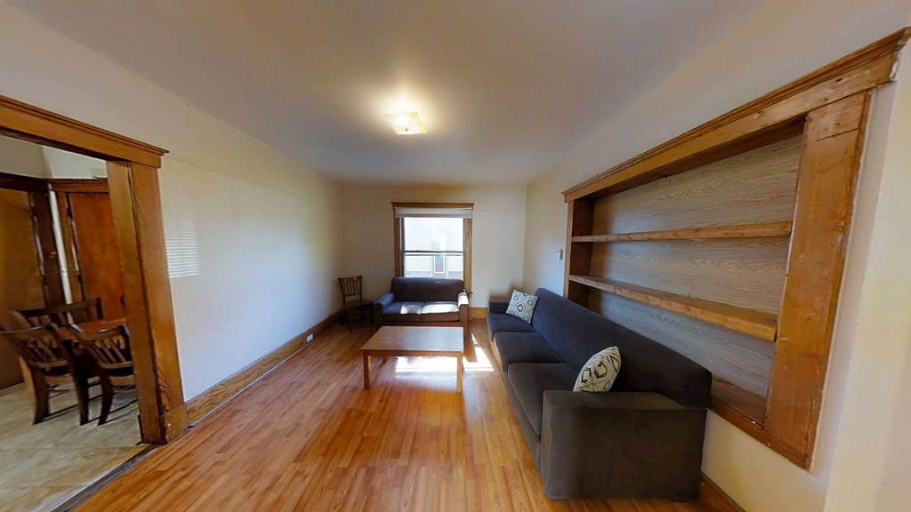 A living room with a couch and a chair.