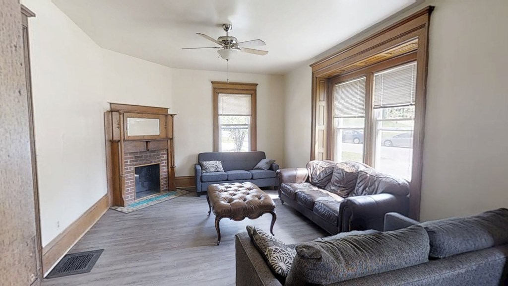 A living room with a fireplace and a couch.