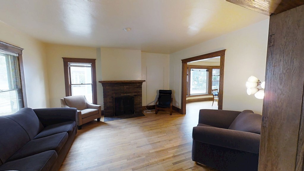 A living room with a fireplace and a couch.