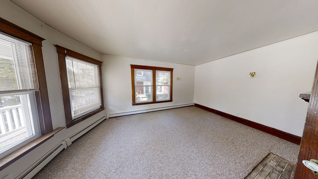 A room with a window and a door.