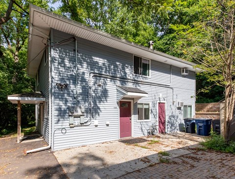 A house with a red door and a red garage door.