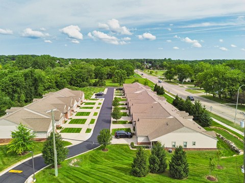 A suburban neighborhood with houses and trees.