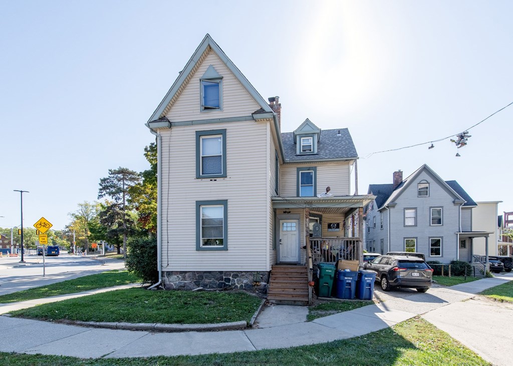 A two-story house with a front porch and a garage.