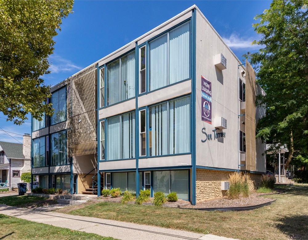 A modern building with a sign that says Sunrise on it.