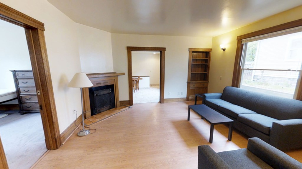A living room with a fireplace and a couch.
