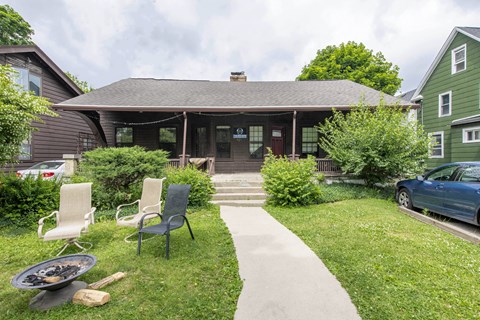 A house with a patio and chairs.