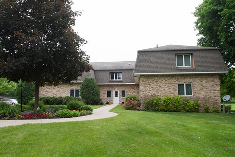 the front of a house with a walkway leading up to it