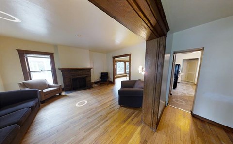 A living room with a fireplace and a couch.