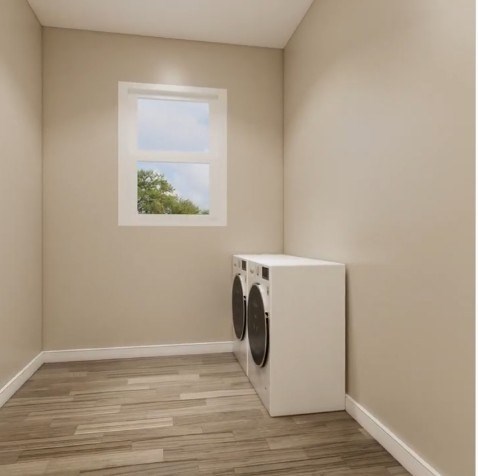 A washing machine is placed in a room with a window.