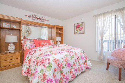 a bedroom with a bed and a dresser