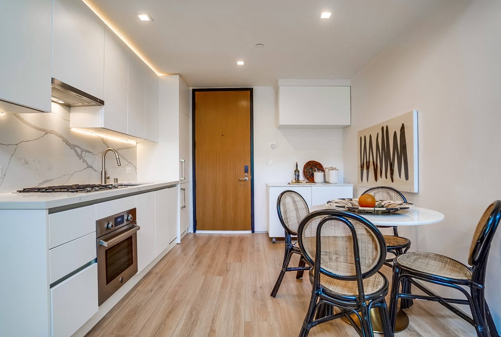 a kitchen and dining area in a 555 waverly unit