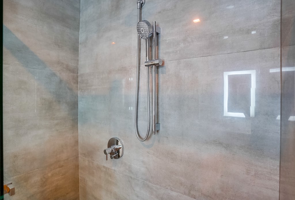a close up of a shower in a bathroom