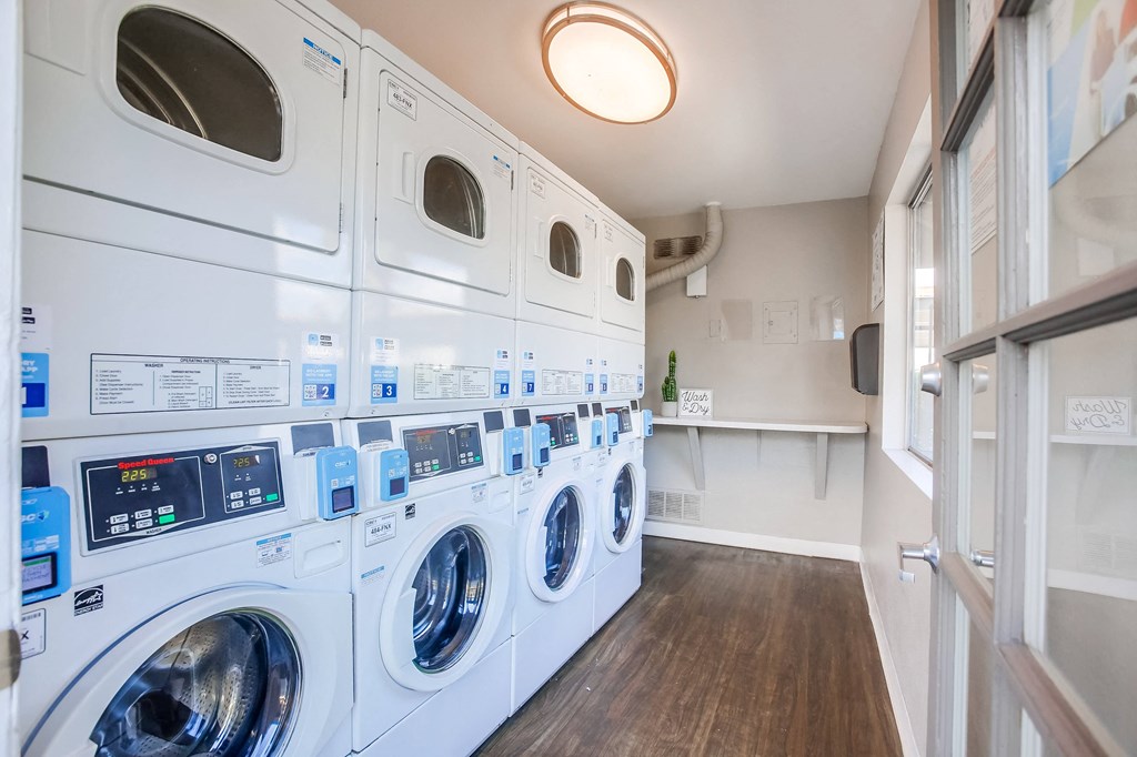 a washer and dryer in a laundry room with a counter