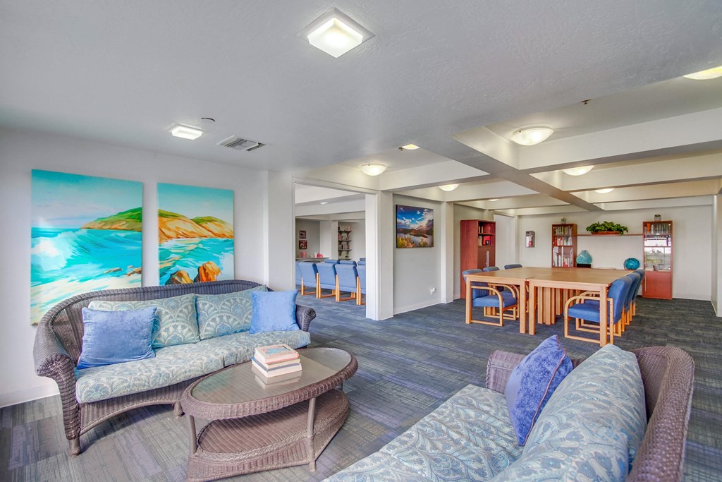 a living room with couches and chairs and a table