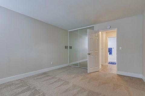 Spacious bedroom with wood flooring at SpringTree Apartments