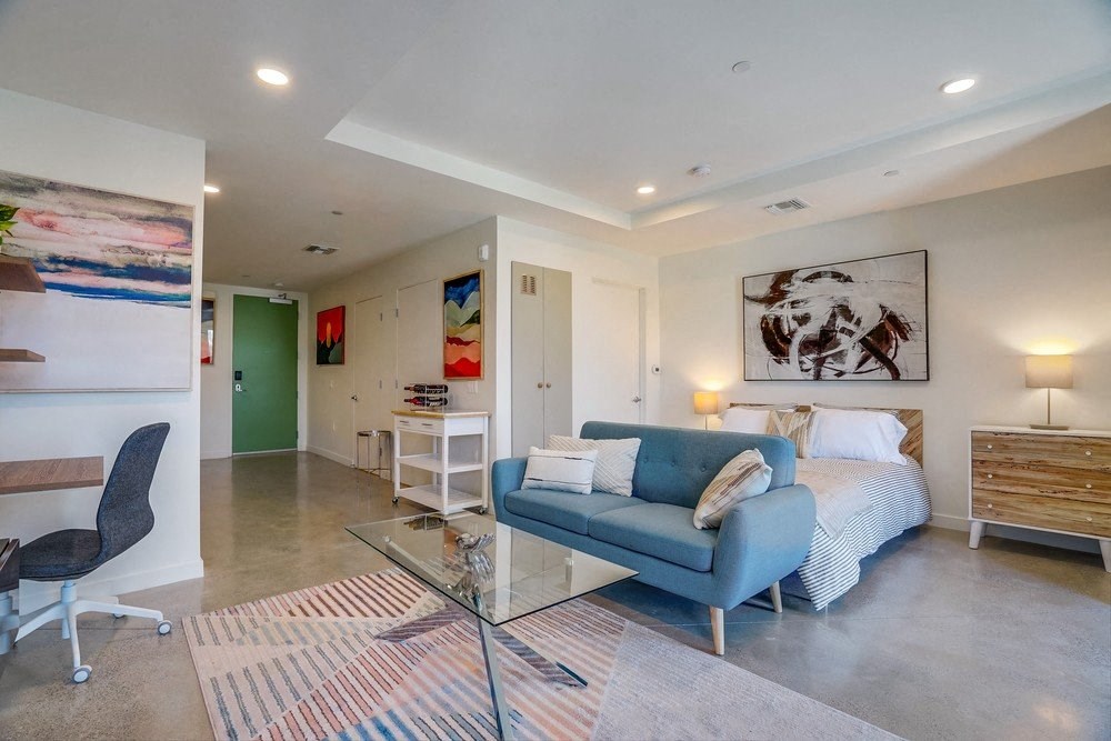 a living room with a couch and a bed