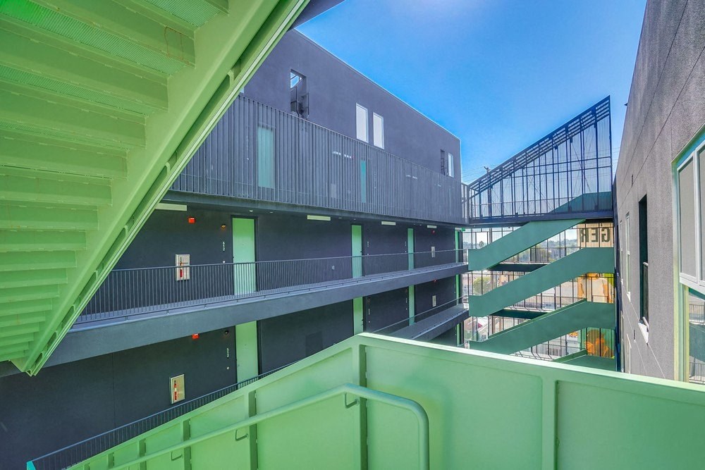 a view of a building with green stairs