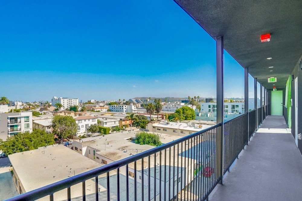 a balcony with a view of the city