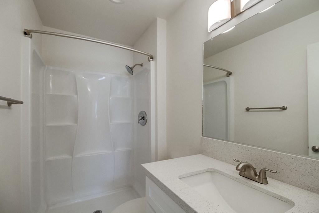a bathroom with a sink and a bathtub