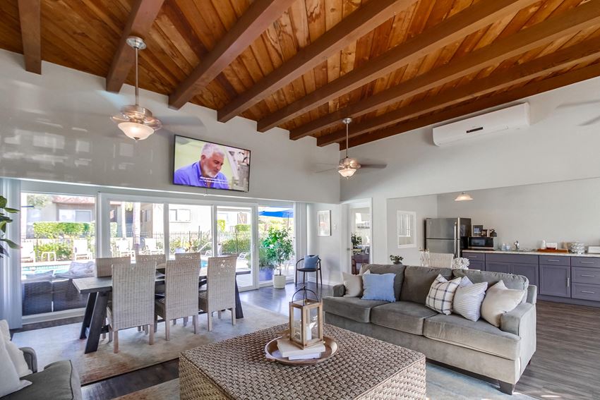 a living room with a couch and a table - Photo Gallery
