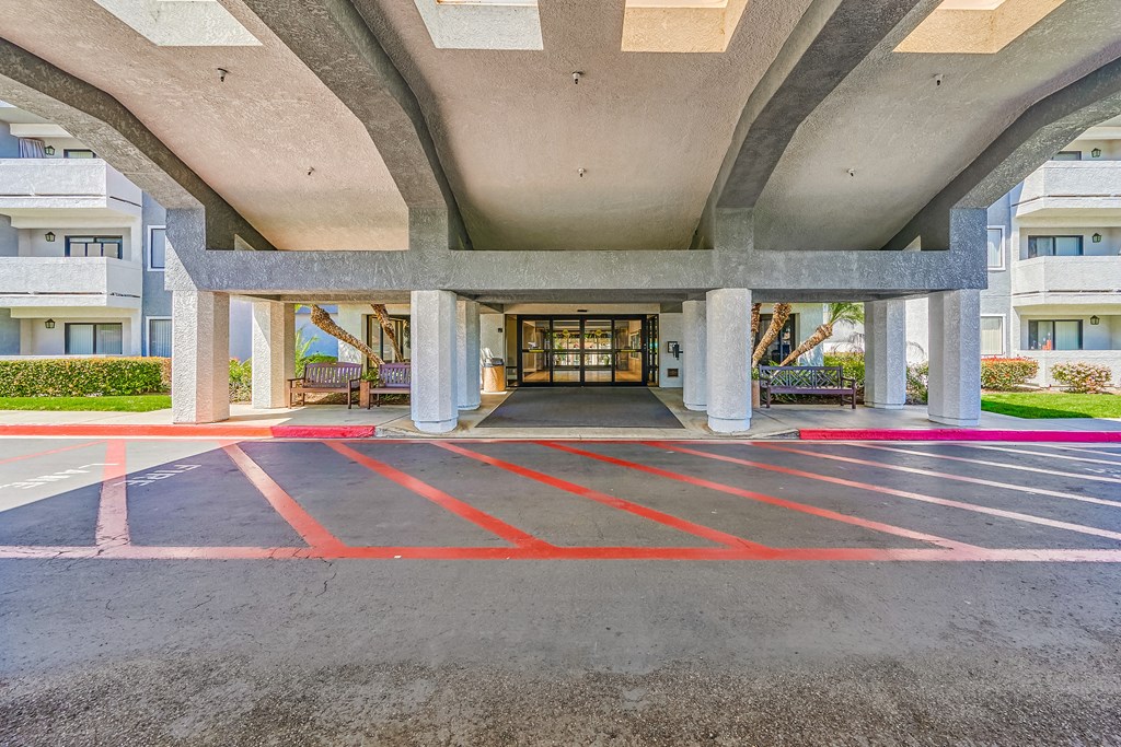 a view of the entrance to the building from the parking lot