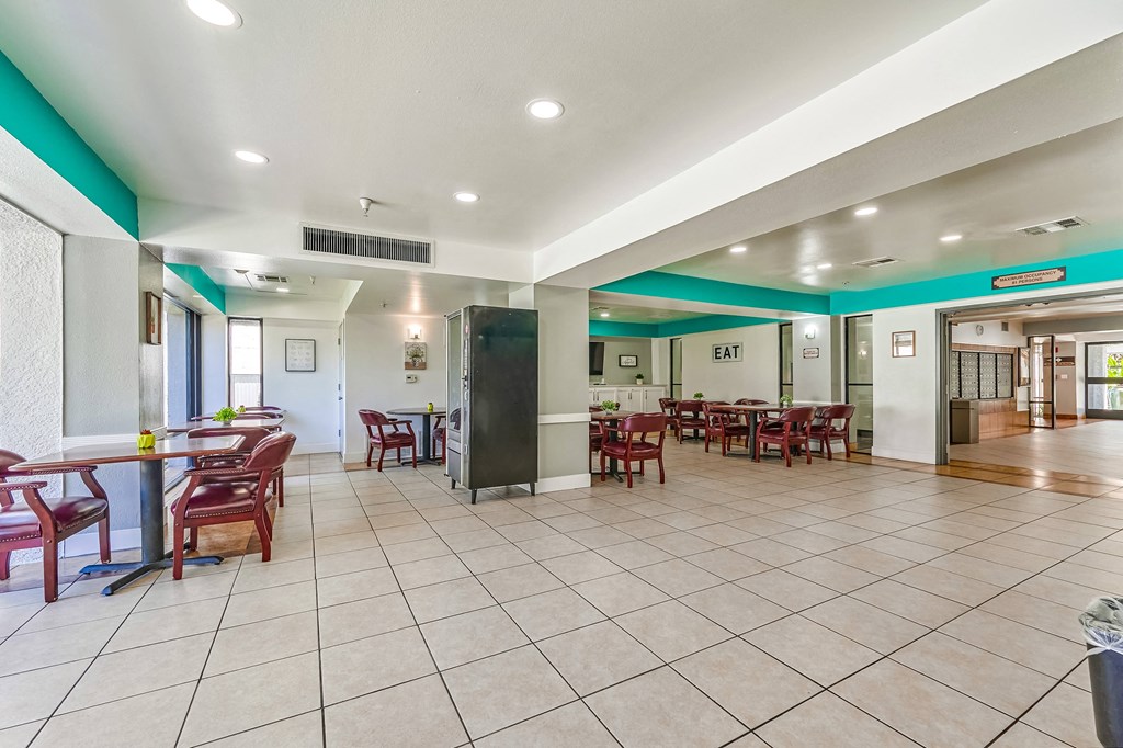 a room with a table and chairs in it