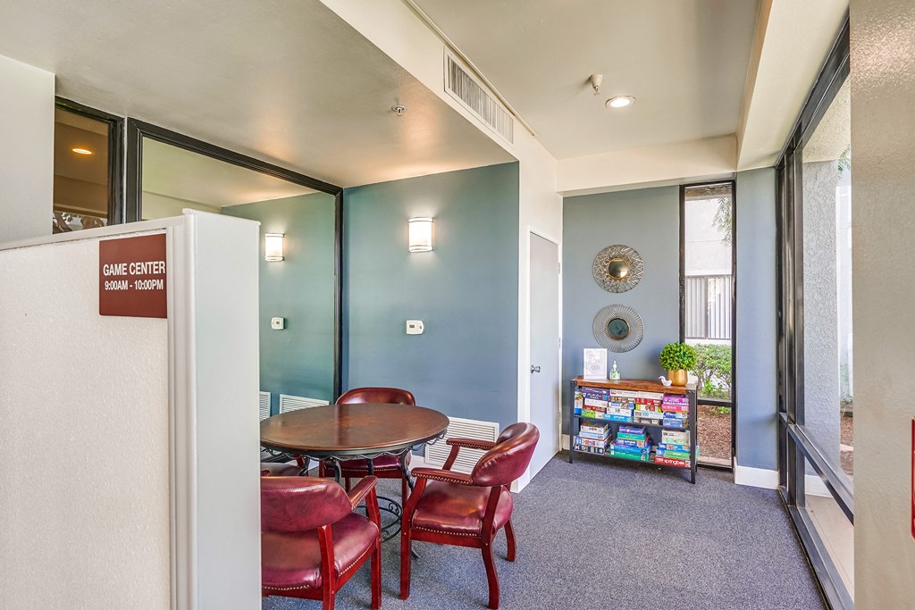 a room with a table and chairs