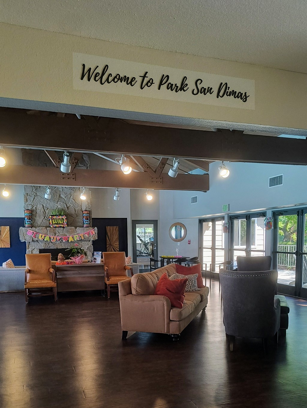 a large lobby with couches chairs and a fireplace