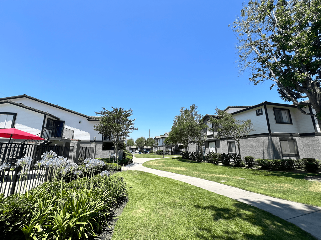 a neighborhood with houses and a sidewalk