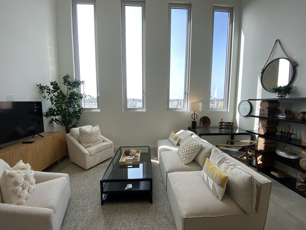 a living room with couches and a coffee table