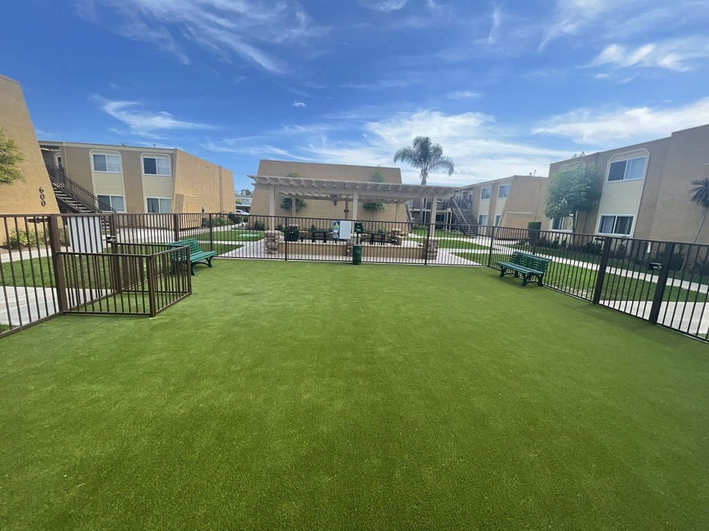 Dog Park and Outdoor Shaded Seating at Whiffle Tree Apartment homes in Huntington Beach, CA.