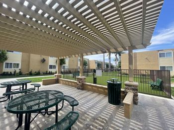 Dog Park and Outdoor Shaded Seating at Whiffle Tree Apartment homes in Huntington Beach, CA.