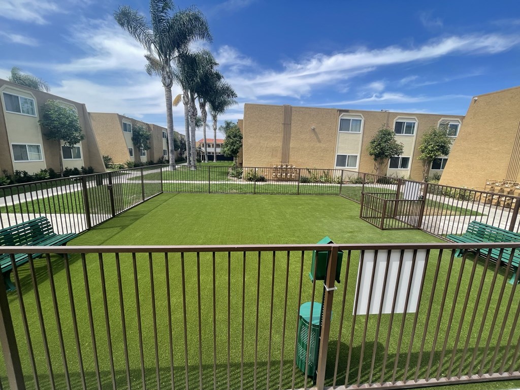 Dog Park and Outdoor Shaded Seating at Whiffle Tree Apartment homes in Huntington Beach, CA.