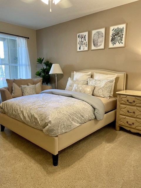 a bedroom with a bed and pillows on it