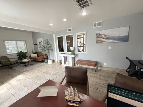 A living room with a brown table and chairs.