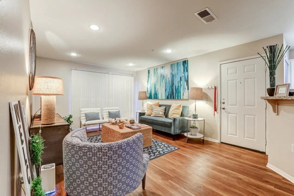 a living room with a couch and a door